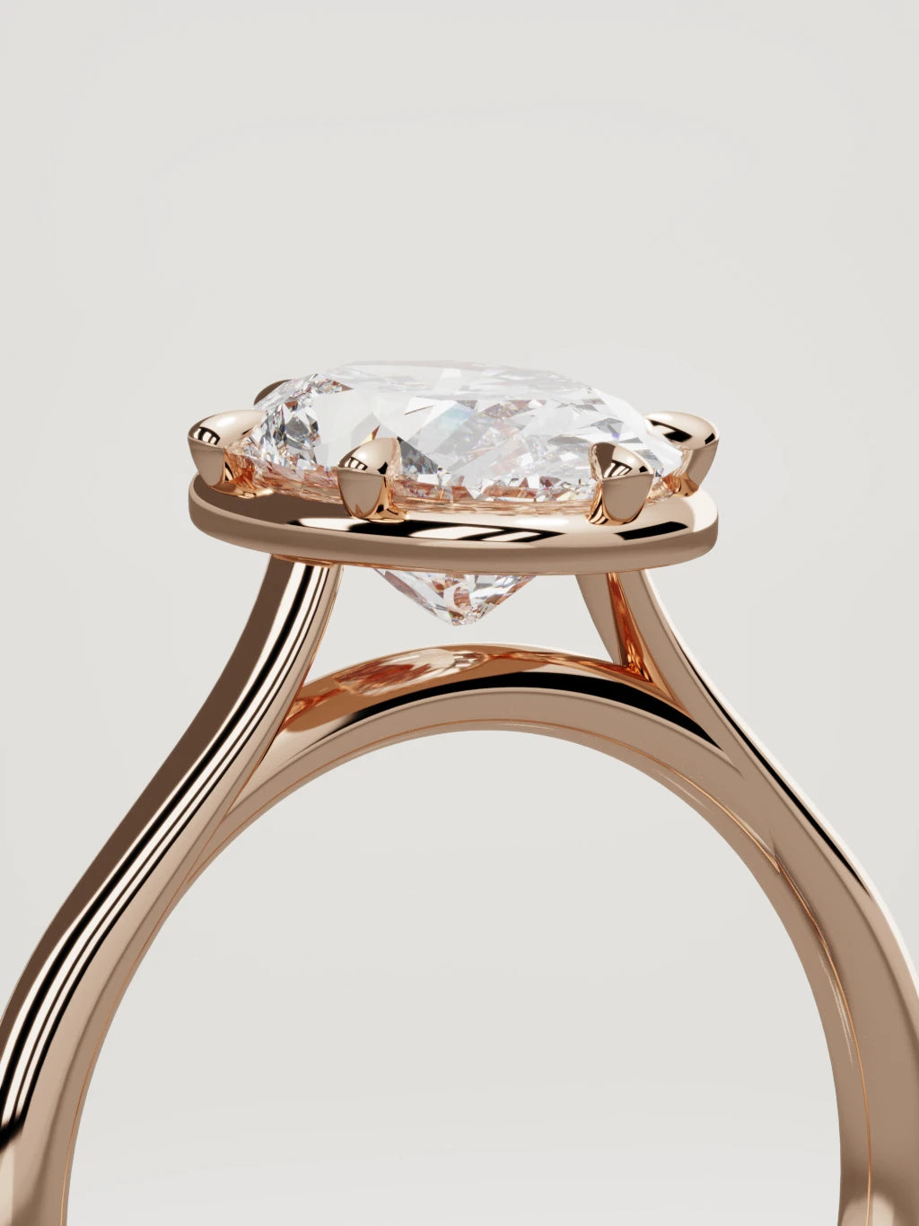 The Orbe oval lab-grown diamond solitaire in 14K rose gold, standing three-quarter view