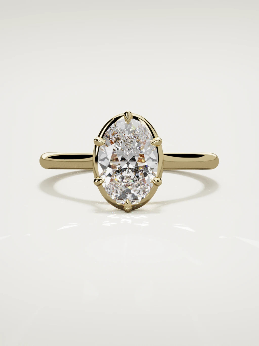 The Orbe oval lab-grown diamond solitaire in 14K yellow gold, front view