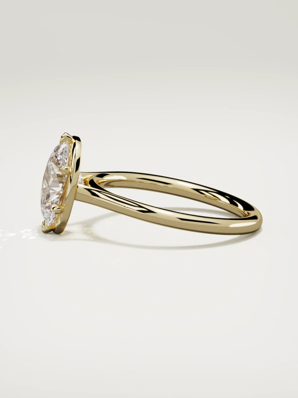 The Orbe oval lab-grown diamond solitaire in 14K yellow gold, side view