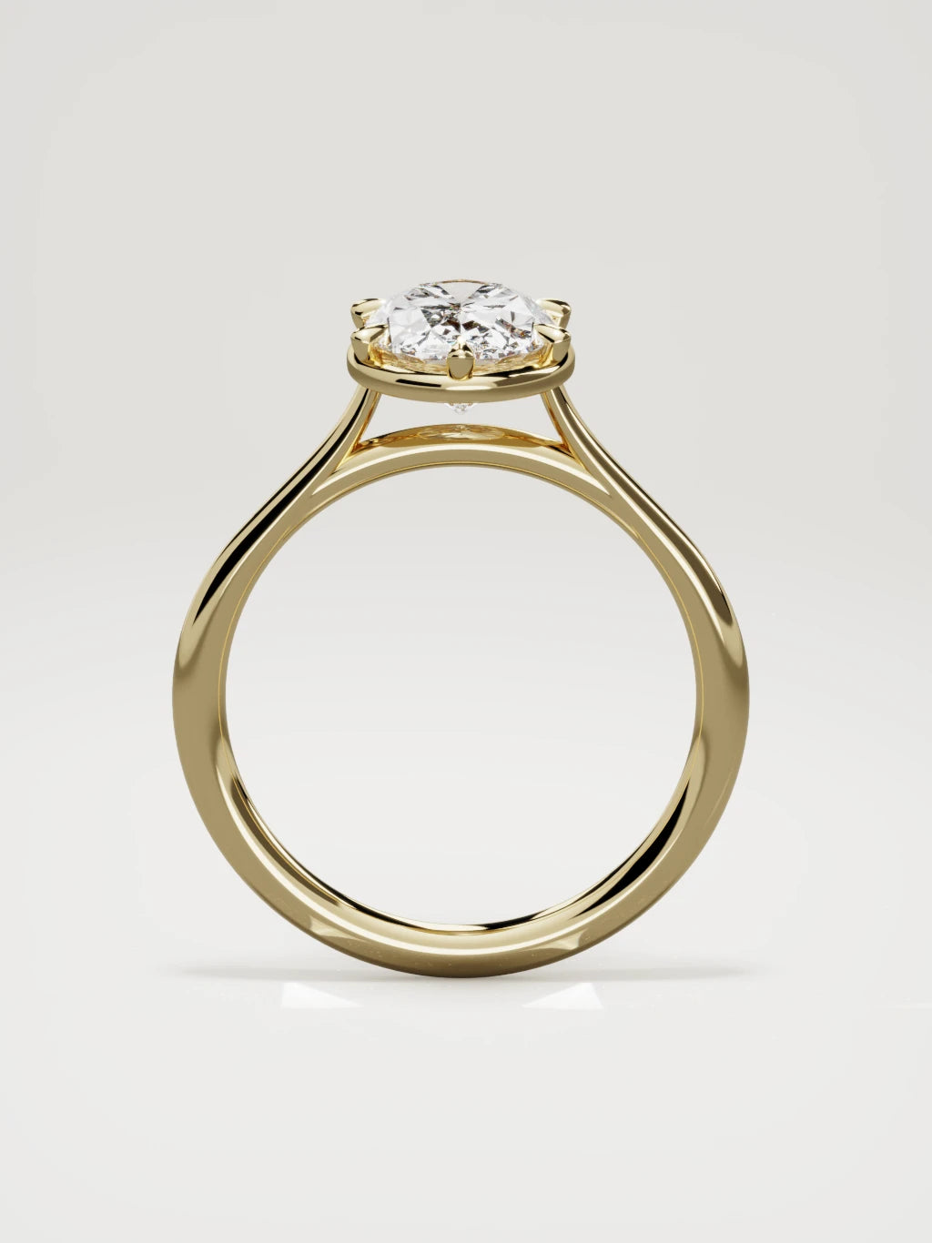 The Orbe oval lab-grown diamond solitaire in 14K yellow gold, standing front view