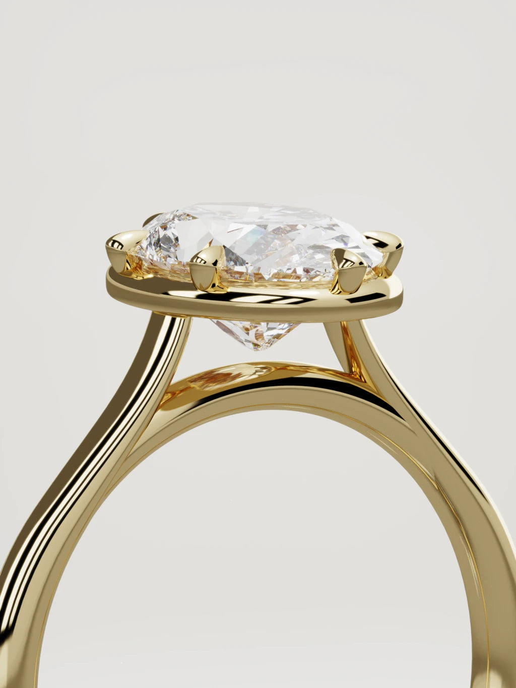 The Orbe oval lab-grown diamond solitaire in 14K yellow gold, standing three-quarter view