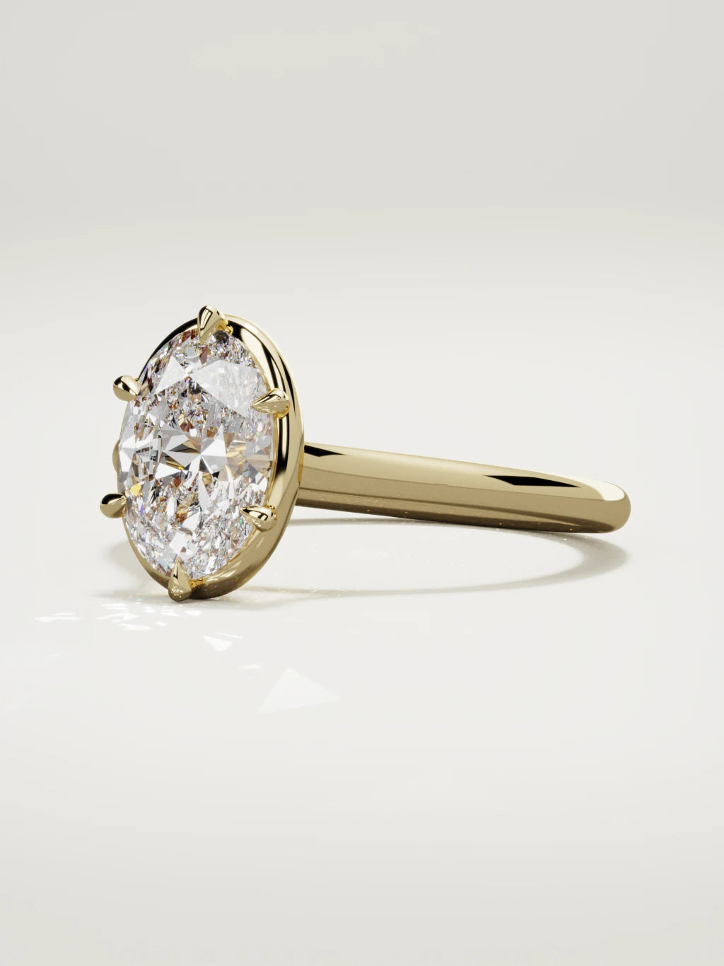 The Orbe oval lab-grown diamond solitaire in 14K yellow gold, three-quarter view