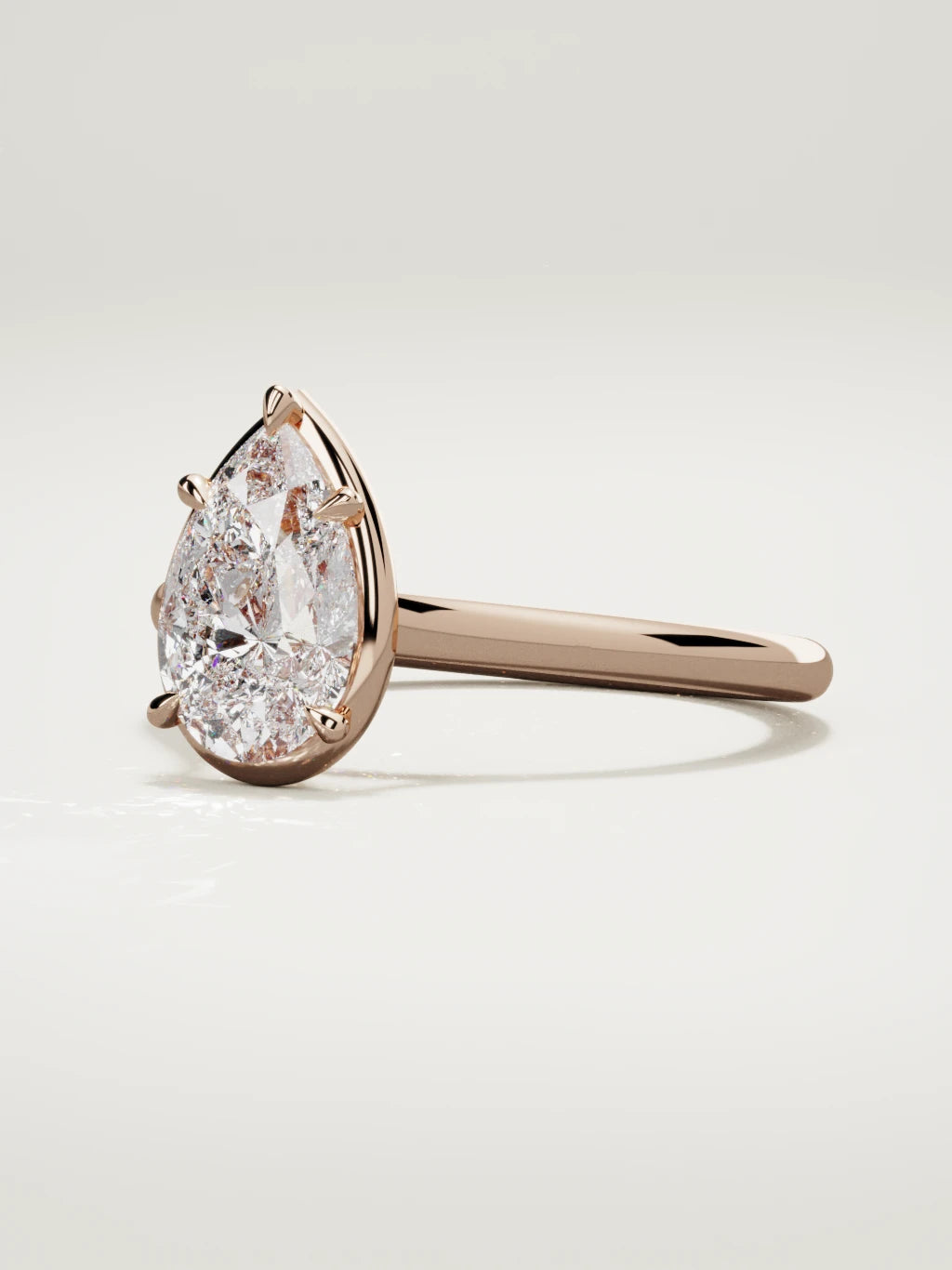 The Orbe pear-shaped lab-grown diamond solitaire in 14K rose gold, three-quarter view