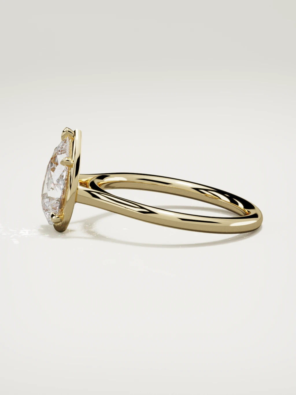 The Orbe pear-shaped lab-grown diamond solitaire in 14K yellow gold, side view