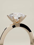 The Prisma round lab-grown diamond solitaire in 14K rose gold, standing three-quarter view