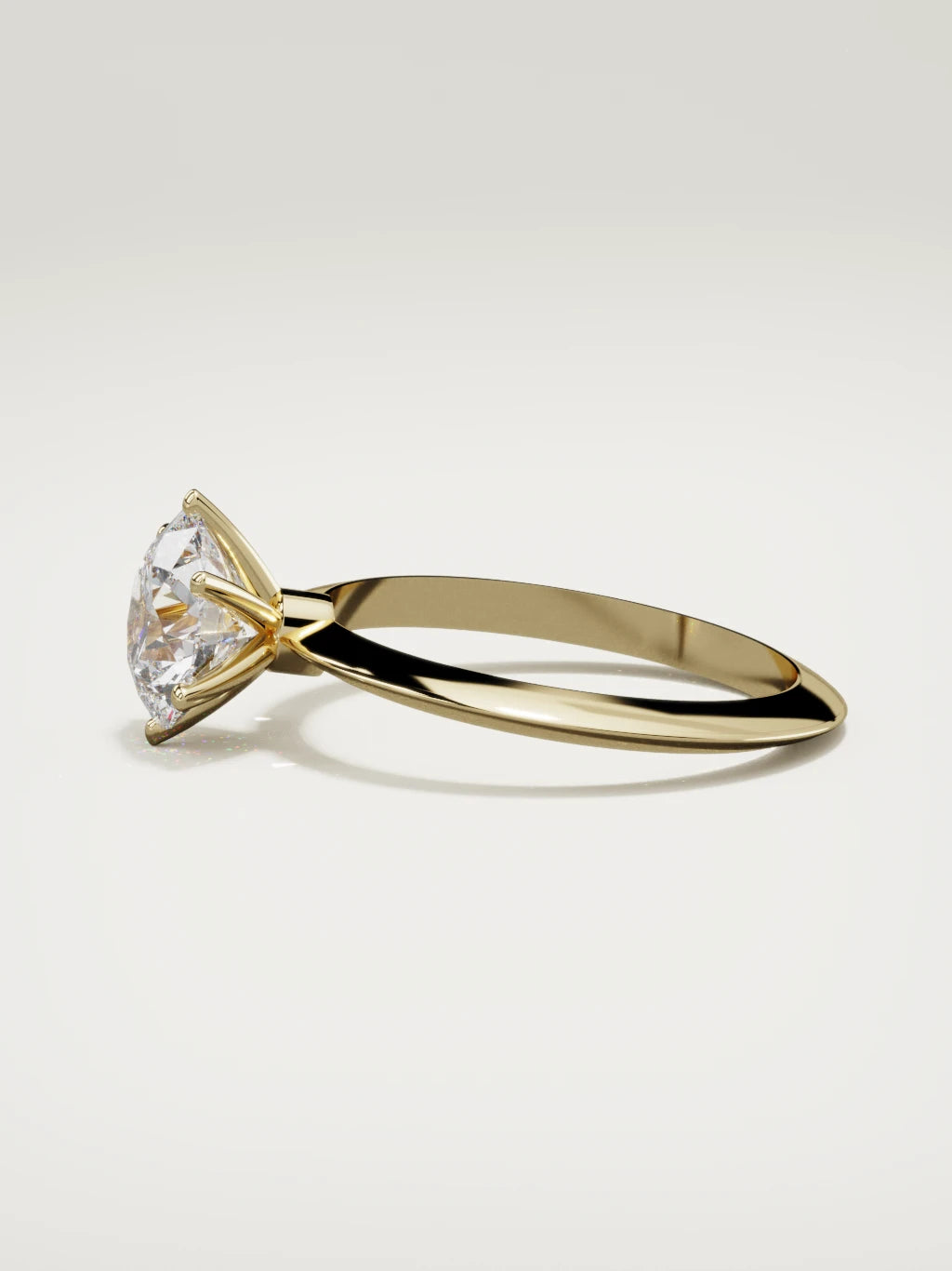 The Prisma round lab-grown diamond solitaire in 14K yellow gold, side view