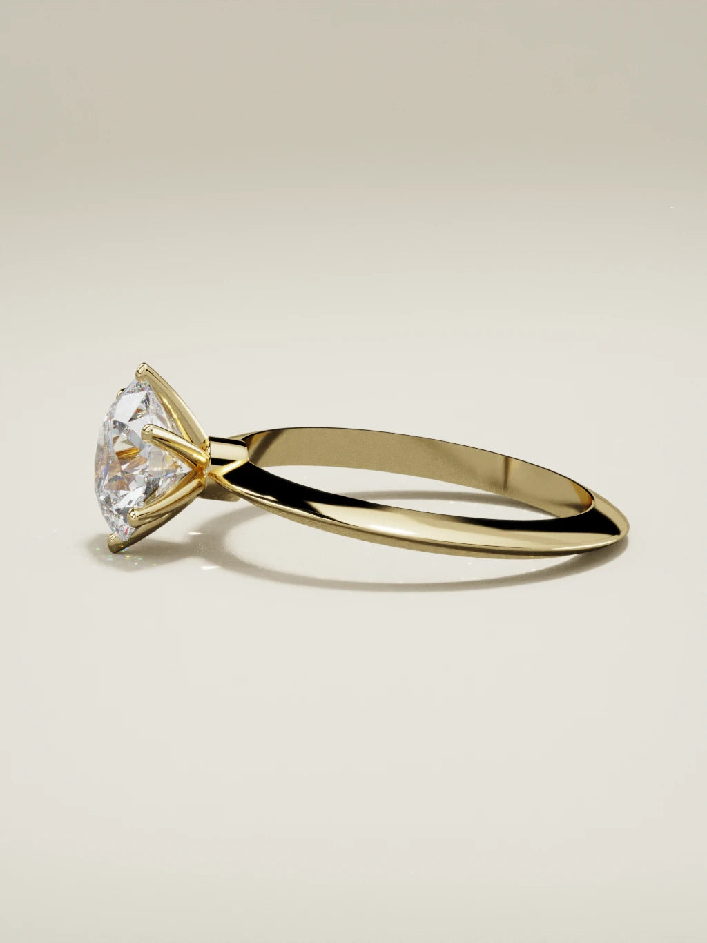 The Prisma round lab-grown diamond solitaire in 14K yellow gold, side view