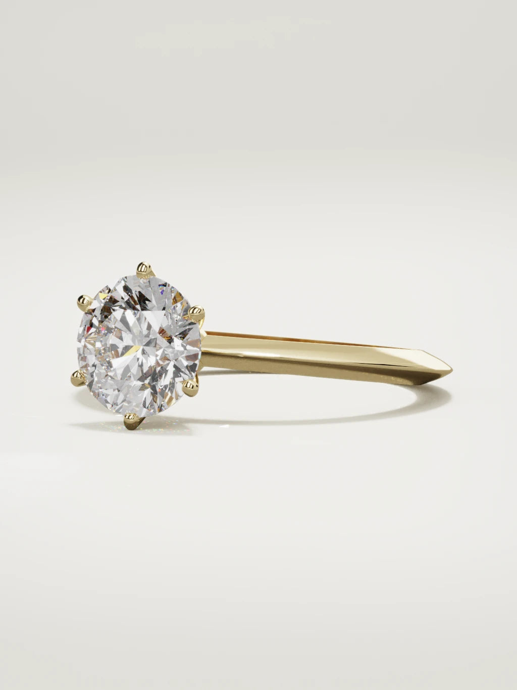 The Prisma round lab-grown diamond solitaire in 14K yellow gold, three-quarter view