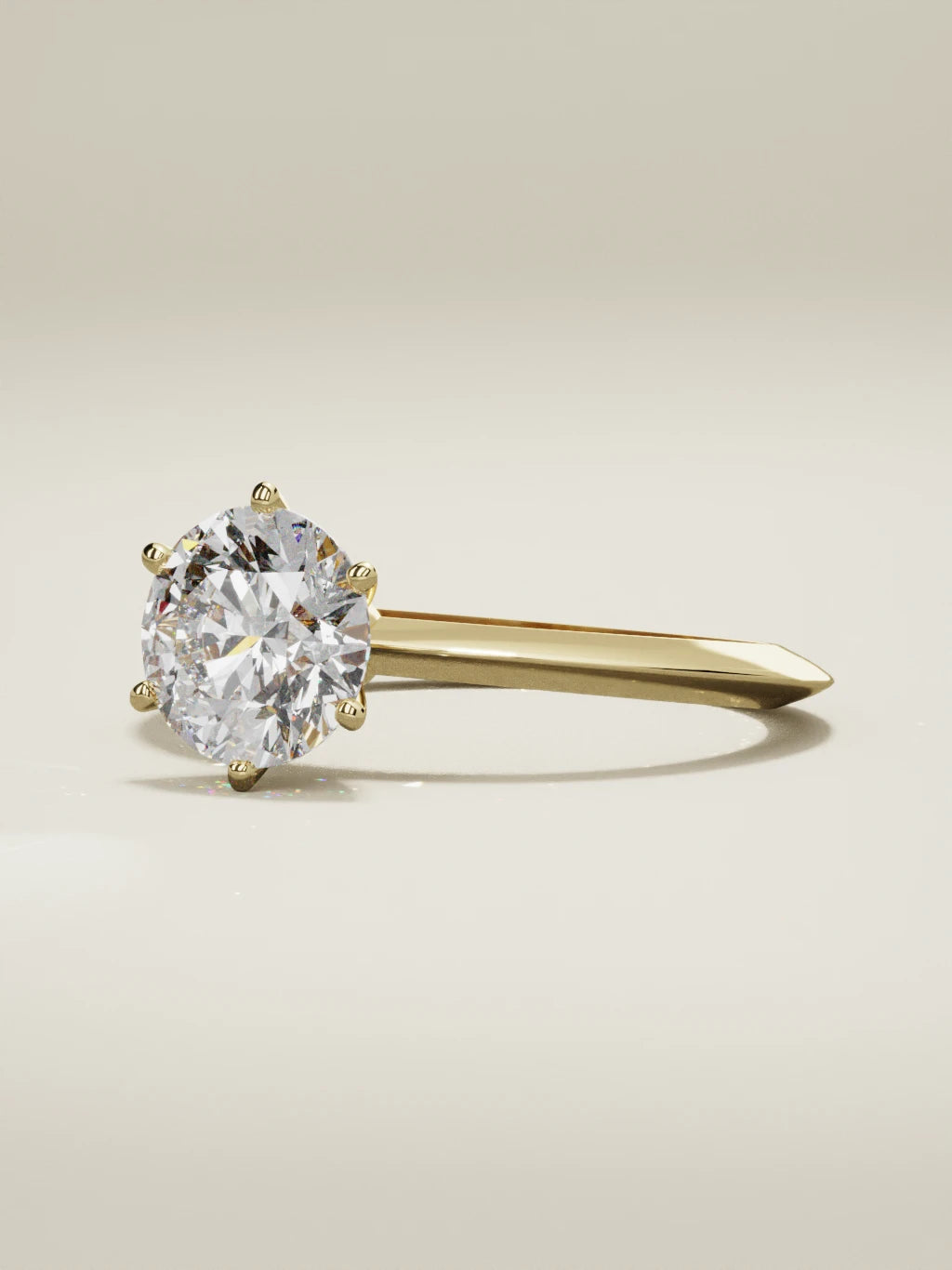 The Prisma round lab-grown diamond solitaire in 14K yellow gold, three-quarter view