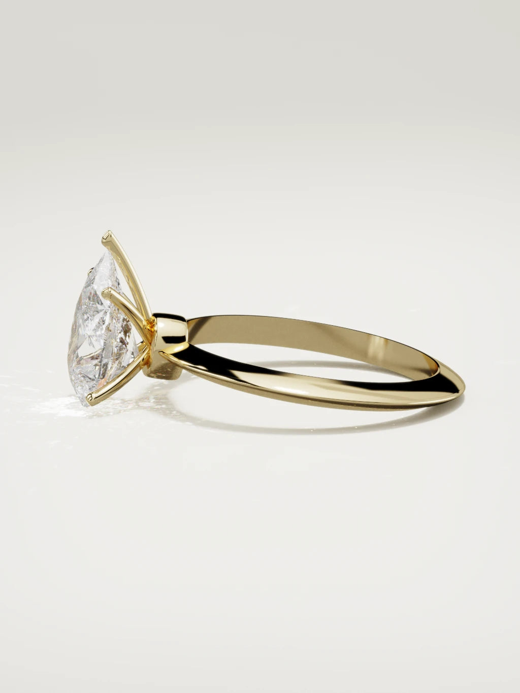 The Prisma pear-shaped lab-grown diamond solitaire in 14K yellow gold, side view