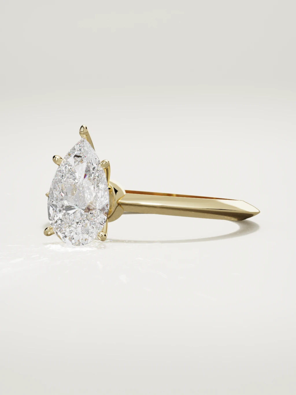 The Prisma pear-shaped lab-grown diamond solitaire in 14K yellow gold, three-quarter view