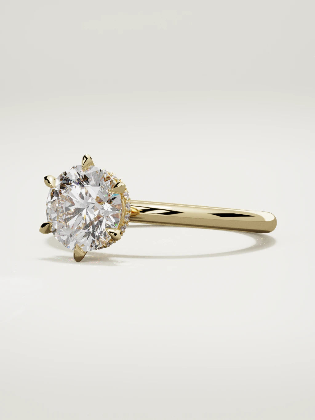 The Velo round lab-grown diamond solitaire in 14K yellow gold, three-quarter view