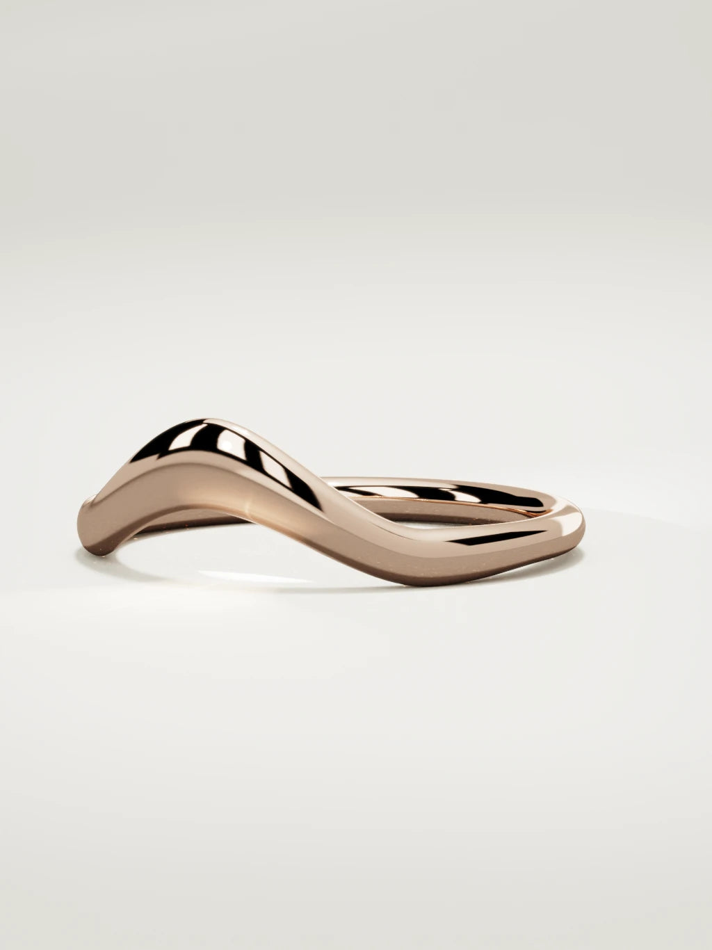 The Aria high contour wedding band in 14K rose gold, three-quarter view