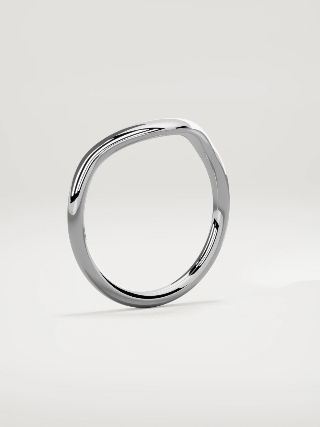 The Aria high contour wedding band in 14K white gold, standing three-quarter view