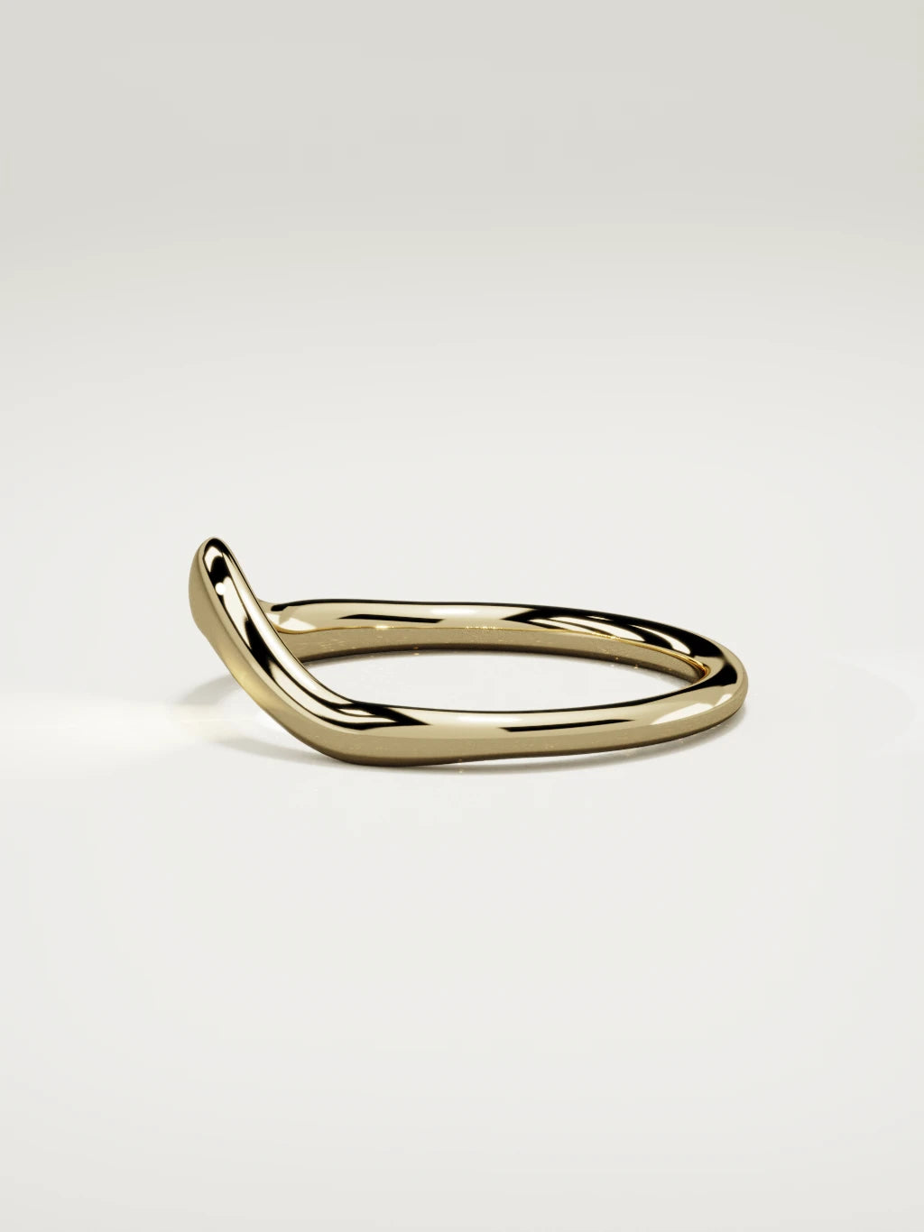The Aria high contour wedding band in 14K yellow gold, side view