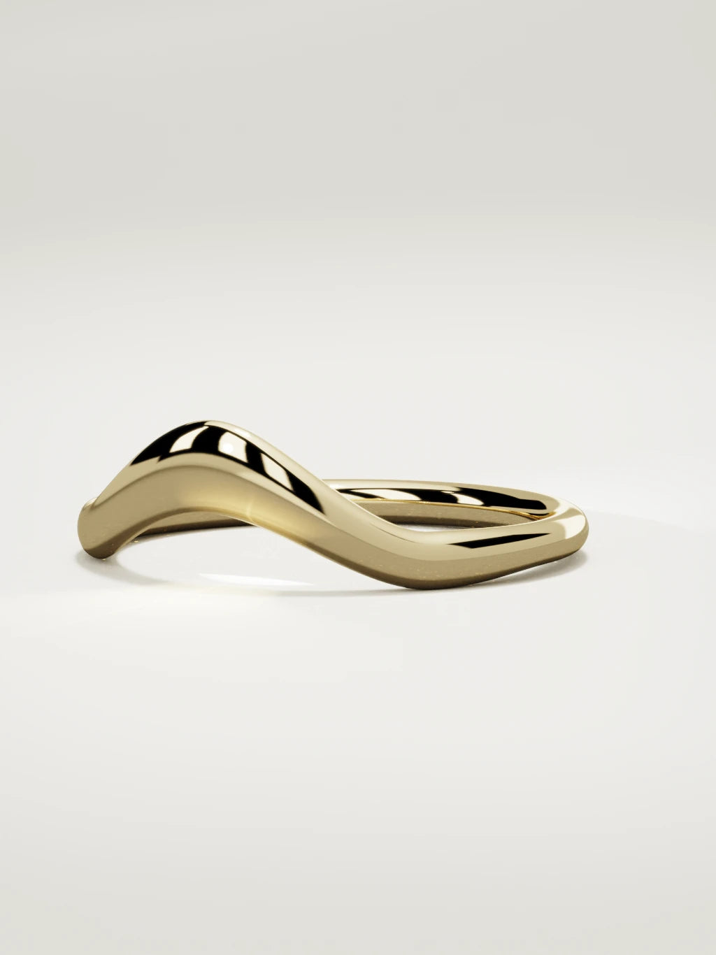 The Aria high contour wedding band in 14K yellow gold, three-quarter view
