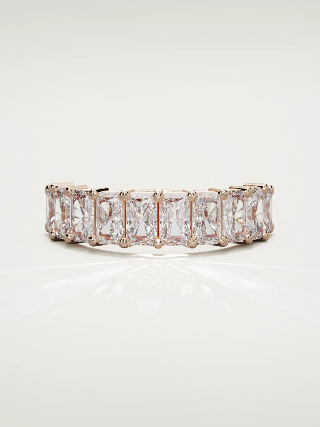 The Astra large prong radiant-cut half eternity band in 14K rose gold, front view