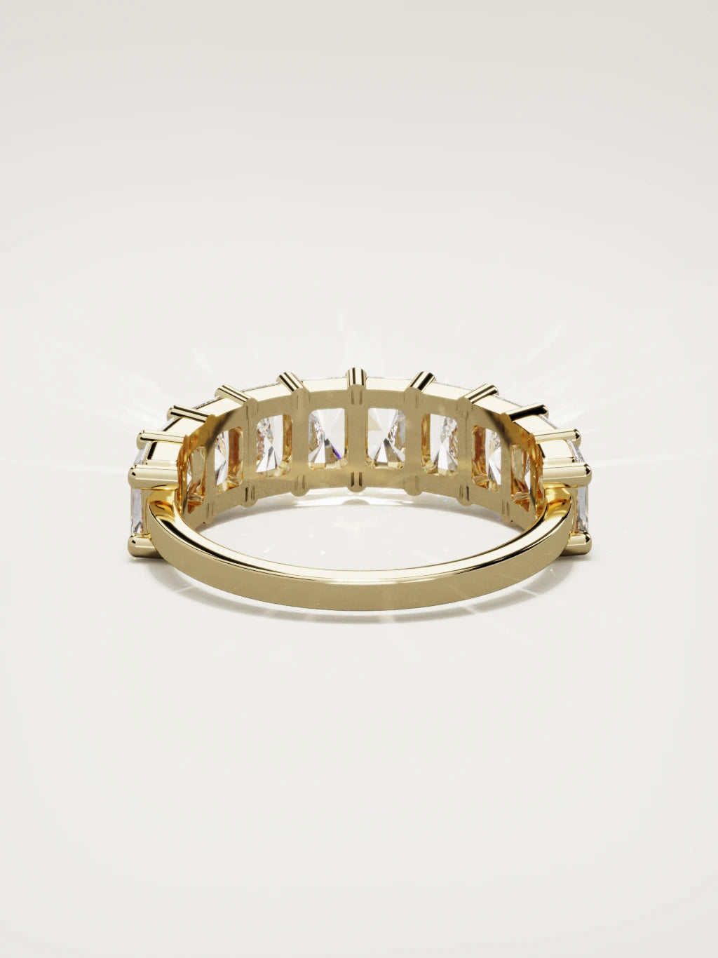 The Astra large prong radiant-cut half eternity band in 14K yellow gold, back view