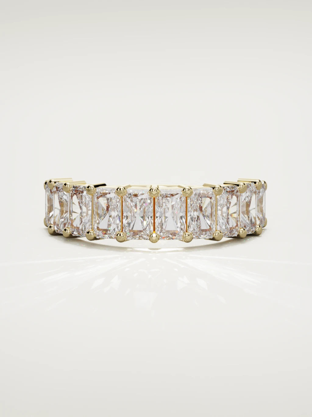 The Astra large prong radiant-cut half eternity band in 14K yellow gold, front view