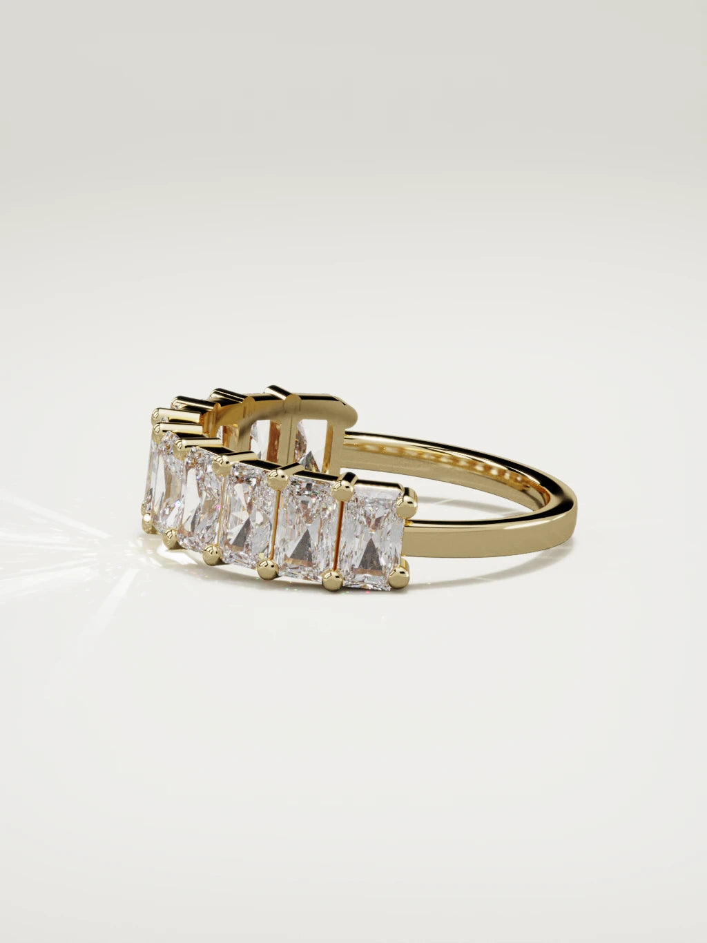 The Astra large prong radiant-cut half eternity band in 14K yellow gold, side view