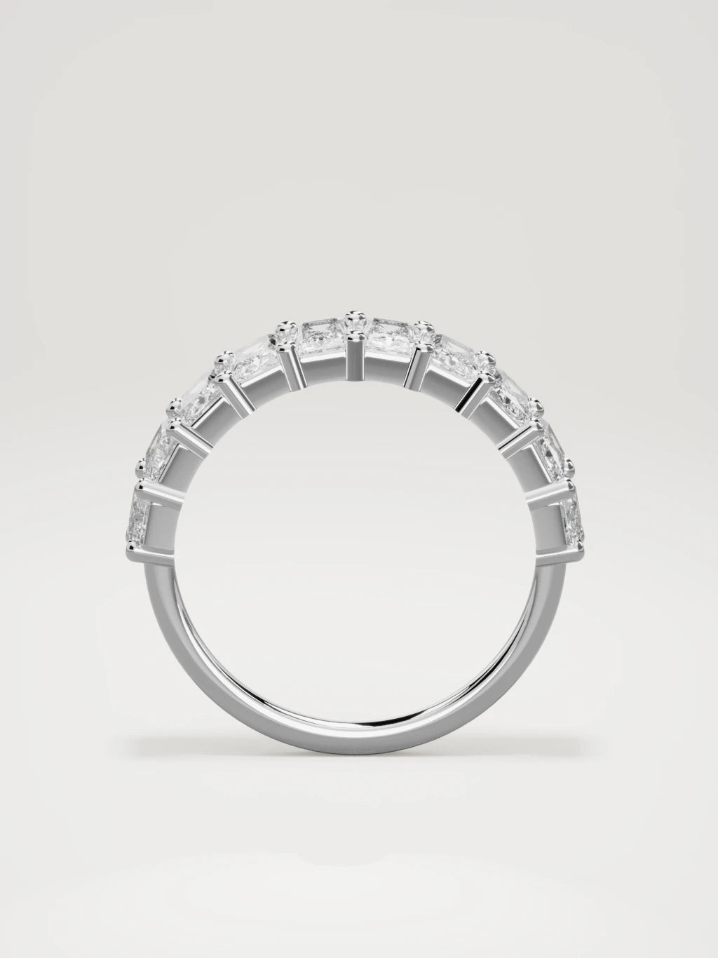 The Astra large prong radiant-cut half eternity band in 14K white gold, standing front view