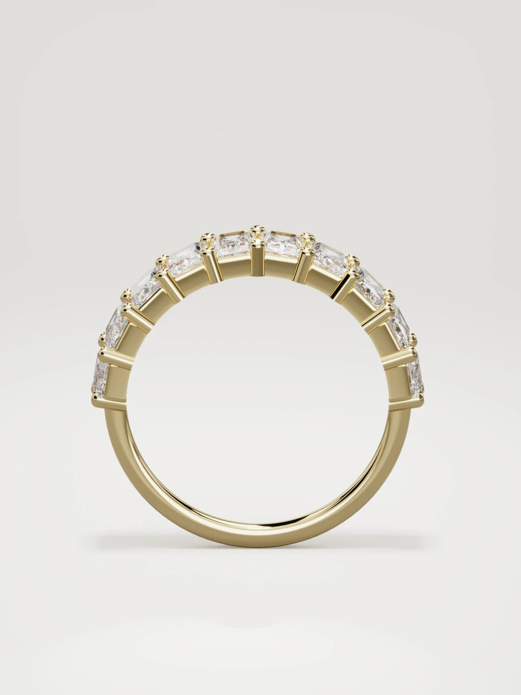 The Astra large prong radiant-cut half eternity band in 14K yellow gold, standing front view