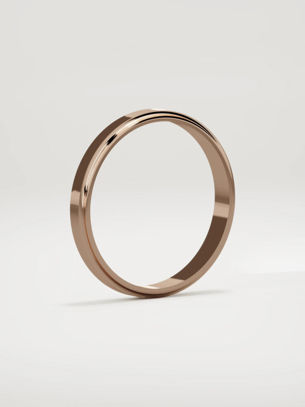 The Marco beveled-edge men's wedding band in 14K rose gold, 3 mm, standing three-quarter view