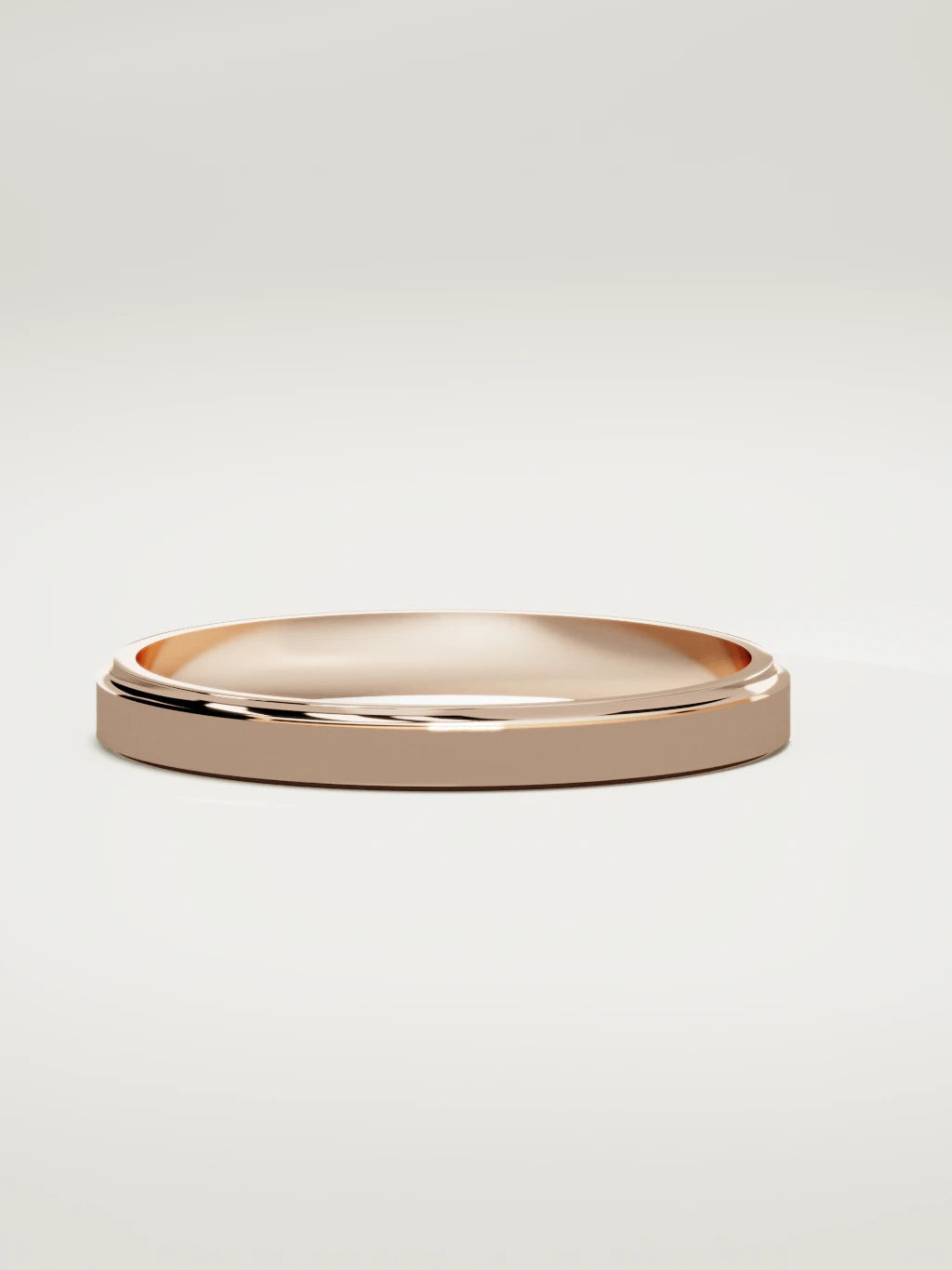 The Marco beveled-edge men's wedding band in 14K rose gold, 3 mm, three-quarter view