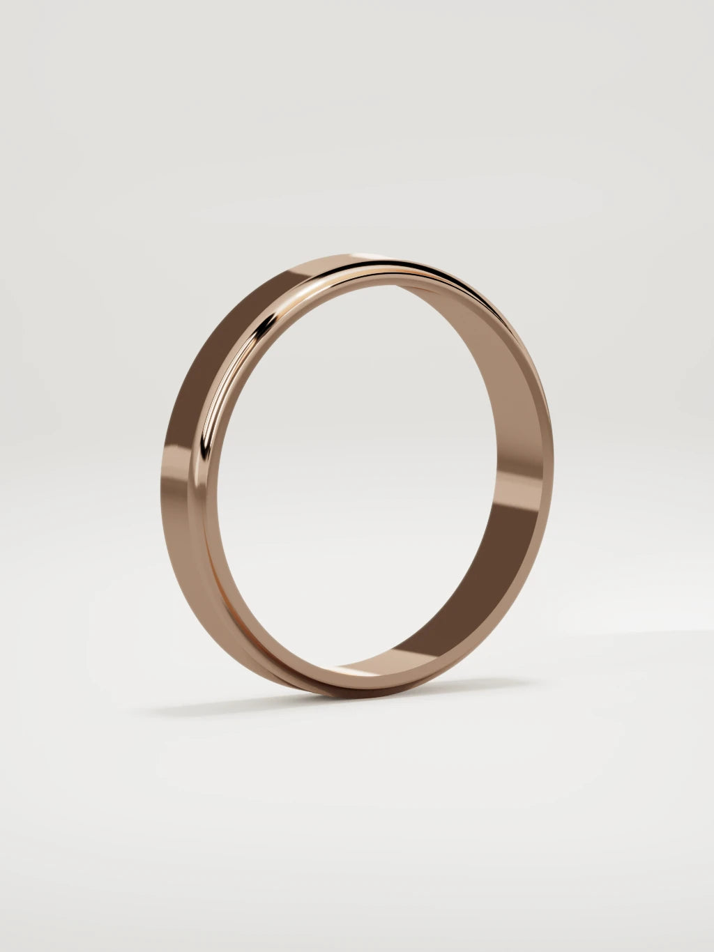 The Marco beveled-edge men's wedding band in 14K rose gold, 4 mm, standing three-quarter view