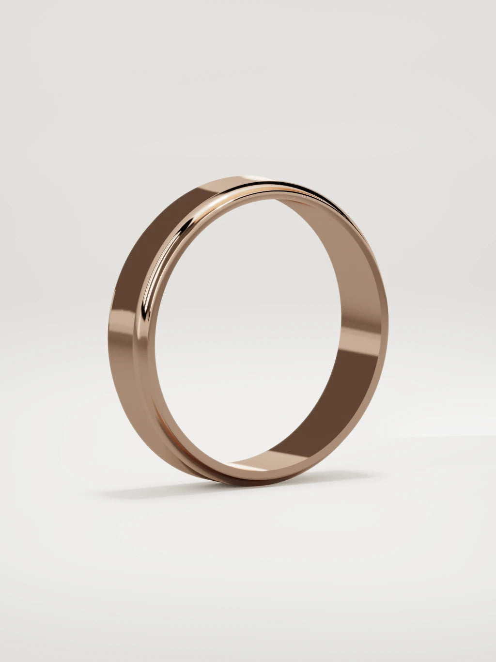 The Marco beveled-edge men's wedding band in 14K rose gold, 5 mm, standing three-quarter view