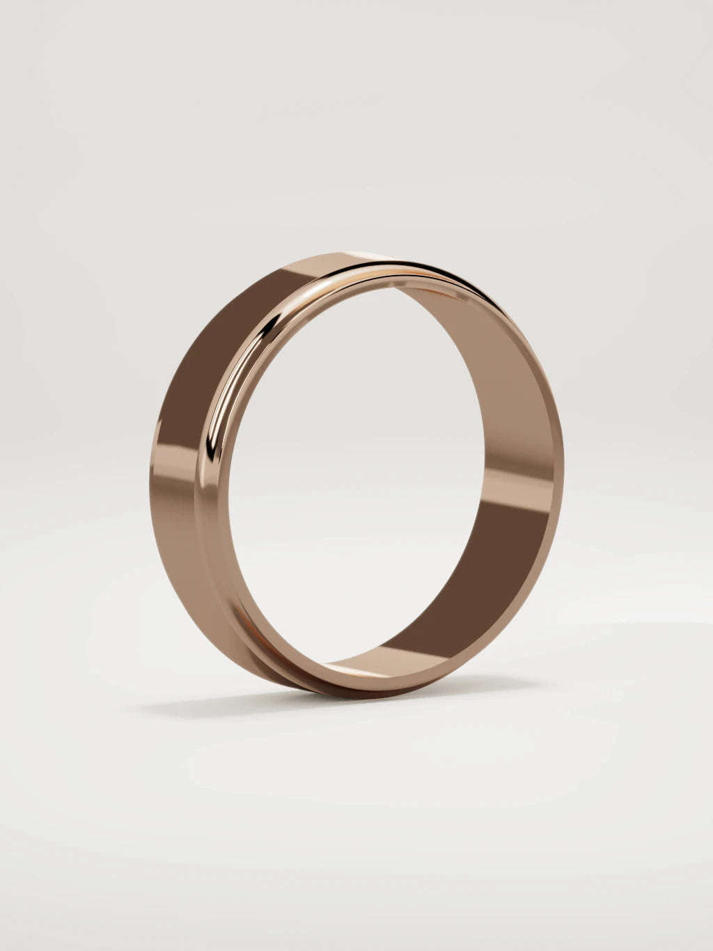 The Marco beveled-edge men's wedding band in 14K rose gold, 6 mm, standing three-quarter view