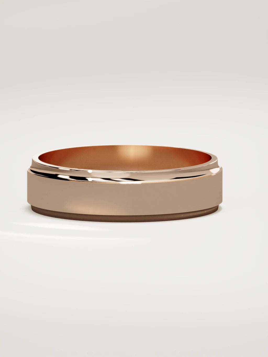 The Marco beveled-edge men's wedding band in 14K rose gold, 6 mm, three-quarter view