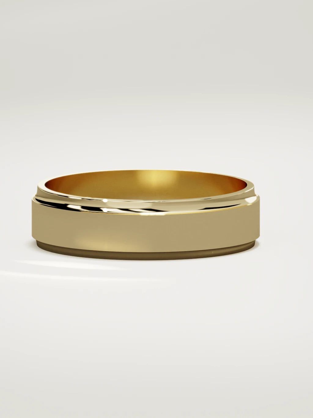 The Marco beveled-edge men's wedding band in 14K yellow gold, 6 mm, three-quarter view