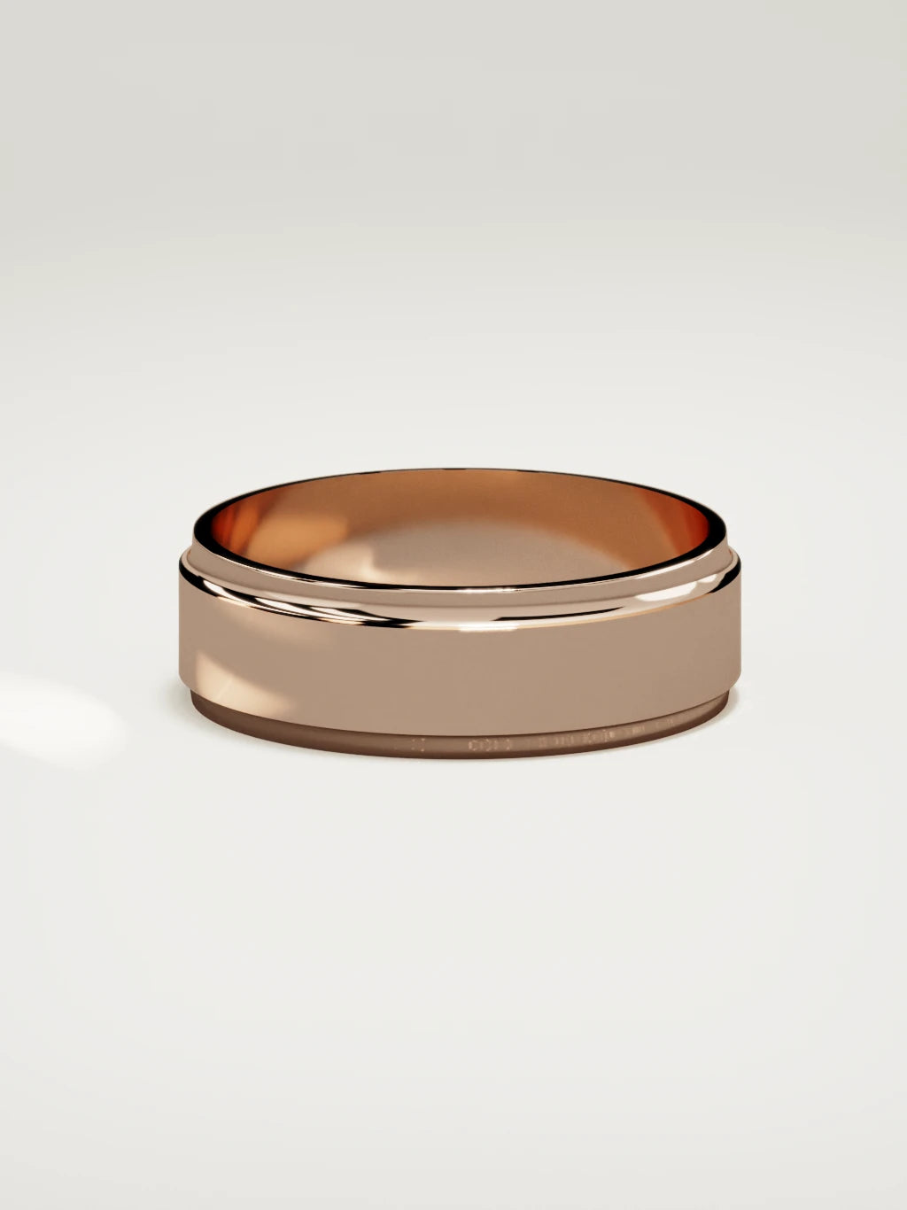 The Marco beveled-edge men's wedding band in 14K rose gold, 7 mm, side view