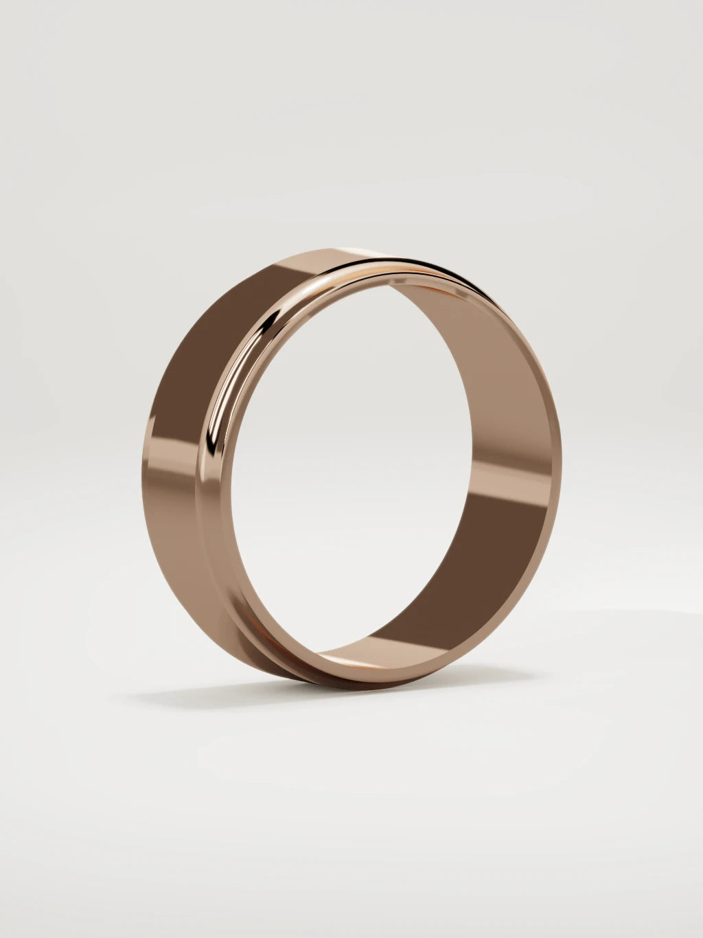 The Marco beveled-edge men's wedding band in 14K rose gold, 7 mm, standing three-quarter view