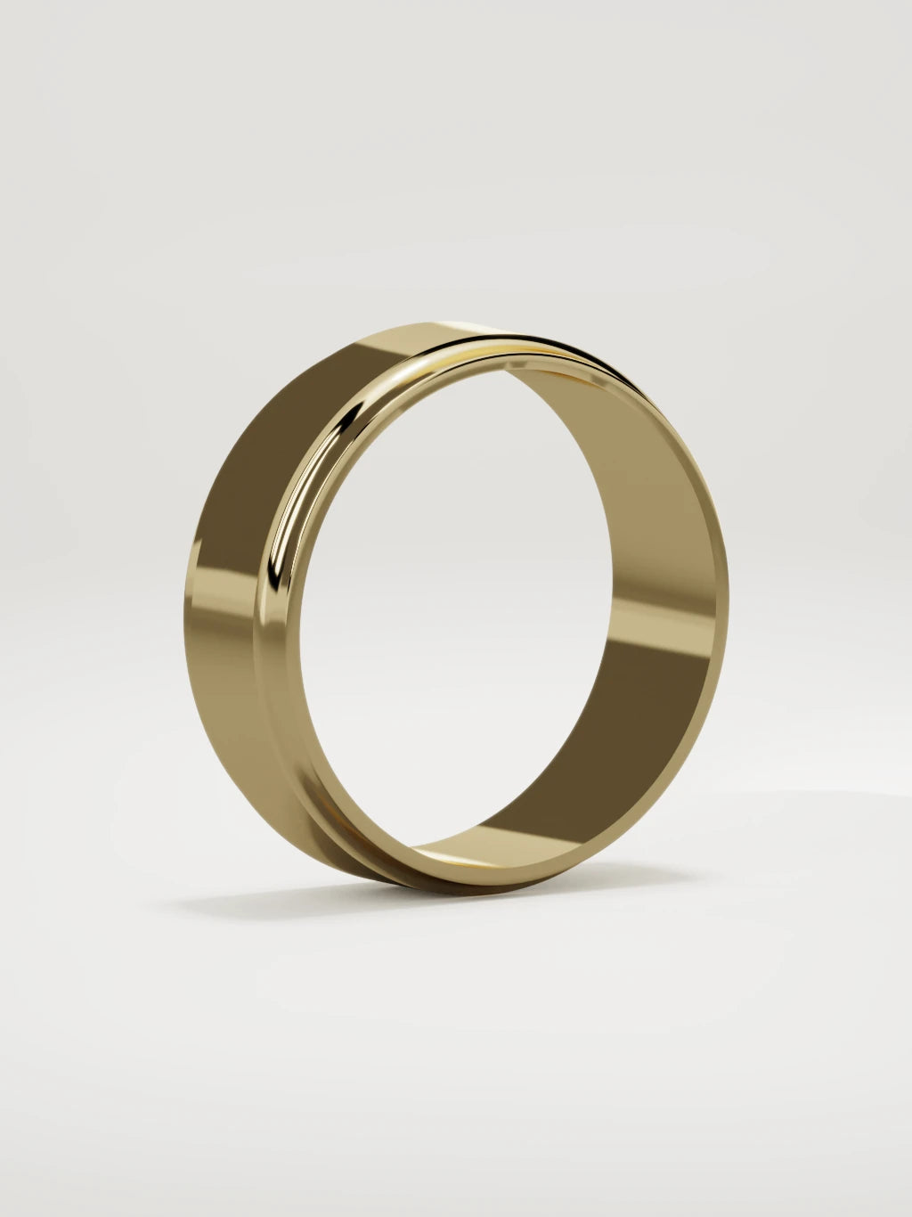 The Marco beveled-edge men's wedding band in 14K yellow gold, 7 mm, standing three-quarter view