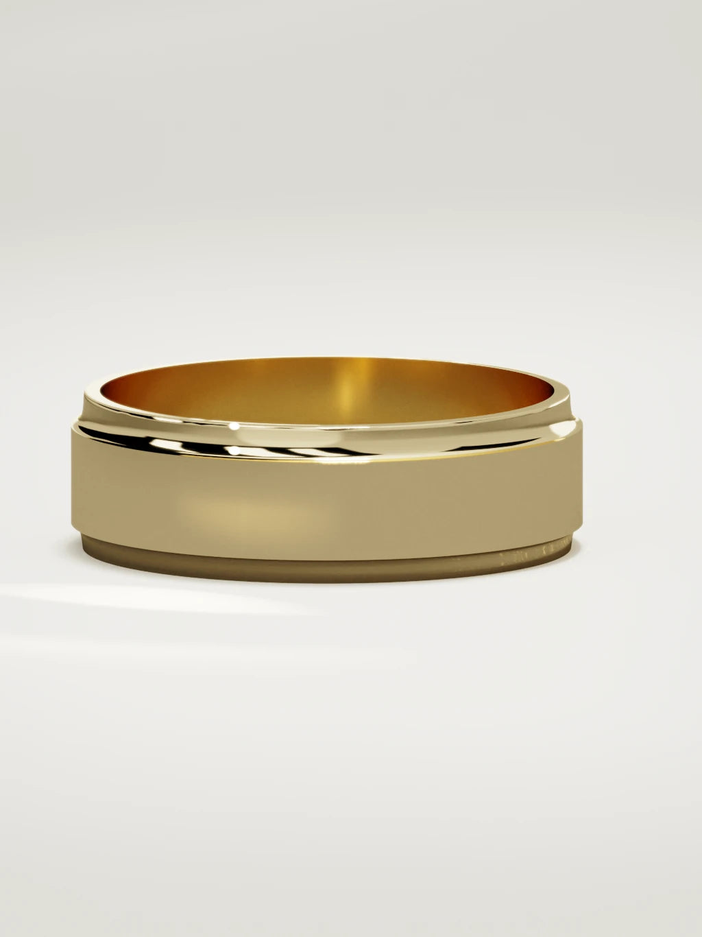 The Marco beveled-edge men's wedding band in 14K yellow gold, 7 mm, three-quarter view