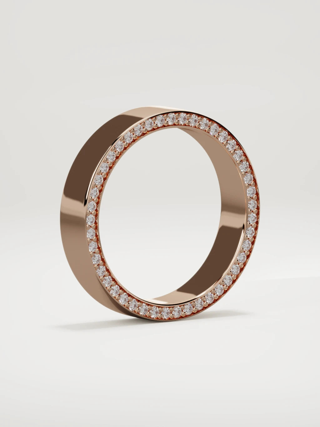The Borde side pave men's wedding band in 14K rose gold, 5 mm, standing three-quarter view