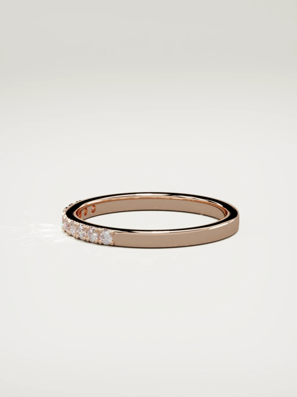 The Brisa petite half eternity band in 14K rose gold, side view