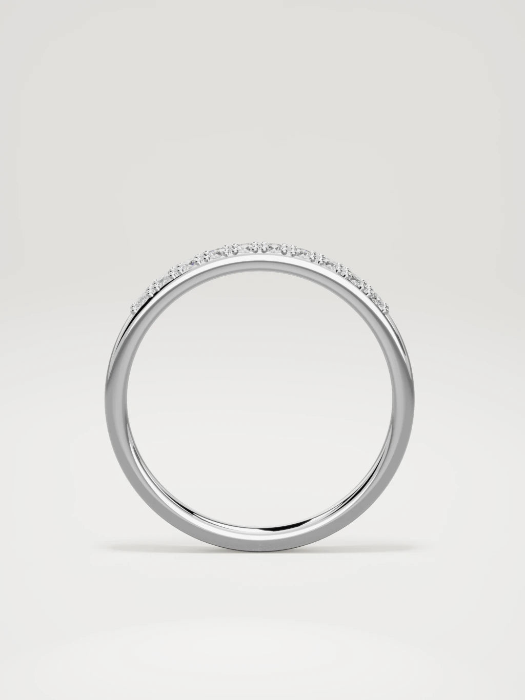 The Brisa petite half eternity band in 14K white gold, standing front view