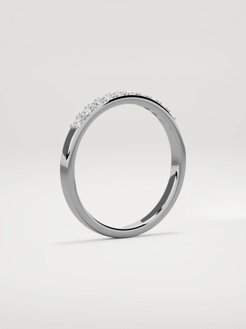 The Brisa petite half eternity band in 14K white gold, standing three-quarter view
