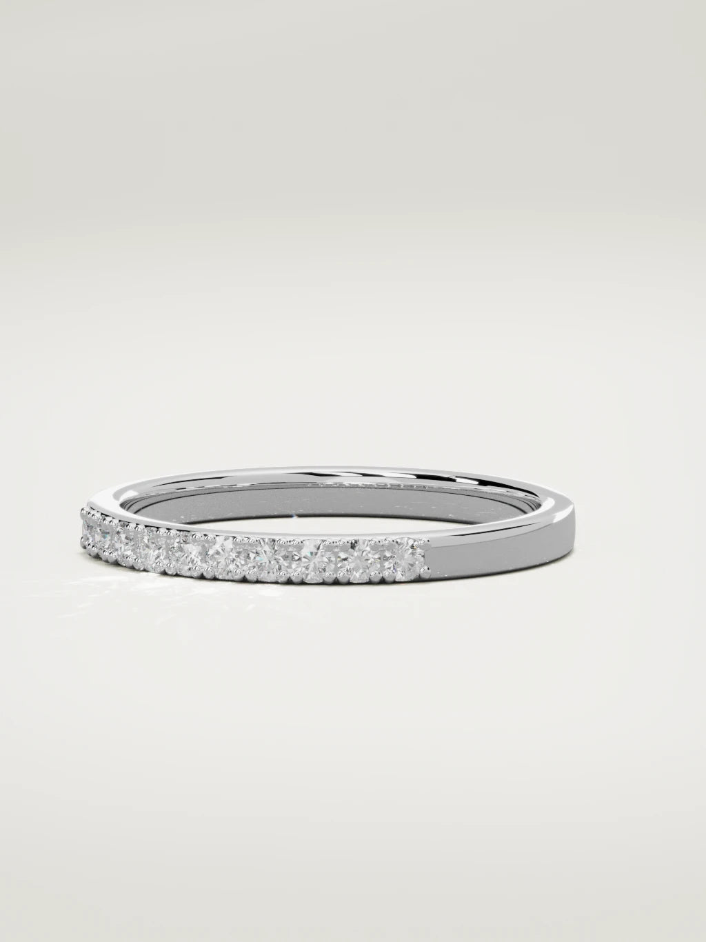 The Brisa petite half eternity band in 14K white gold, three-quarter view
