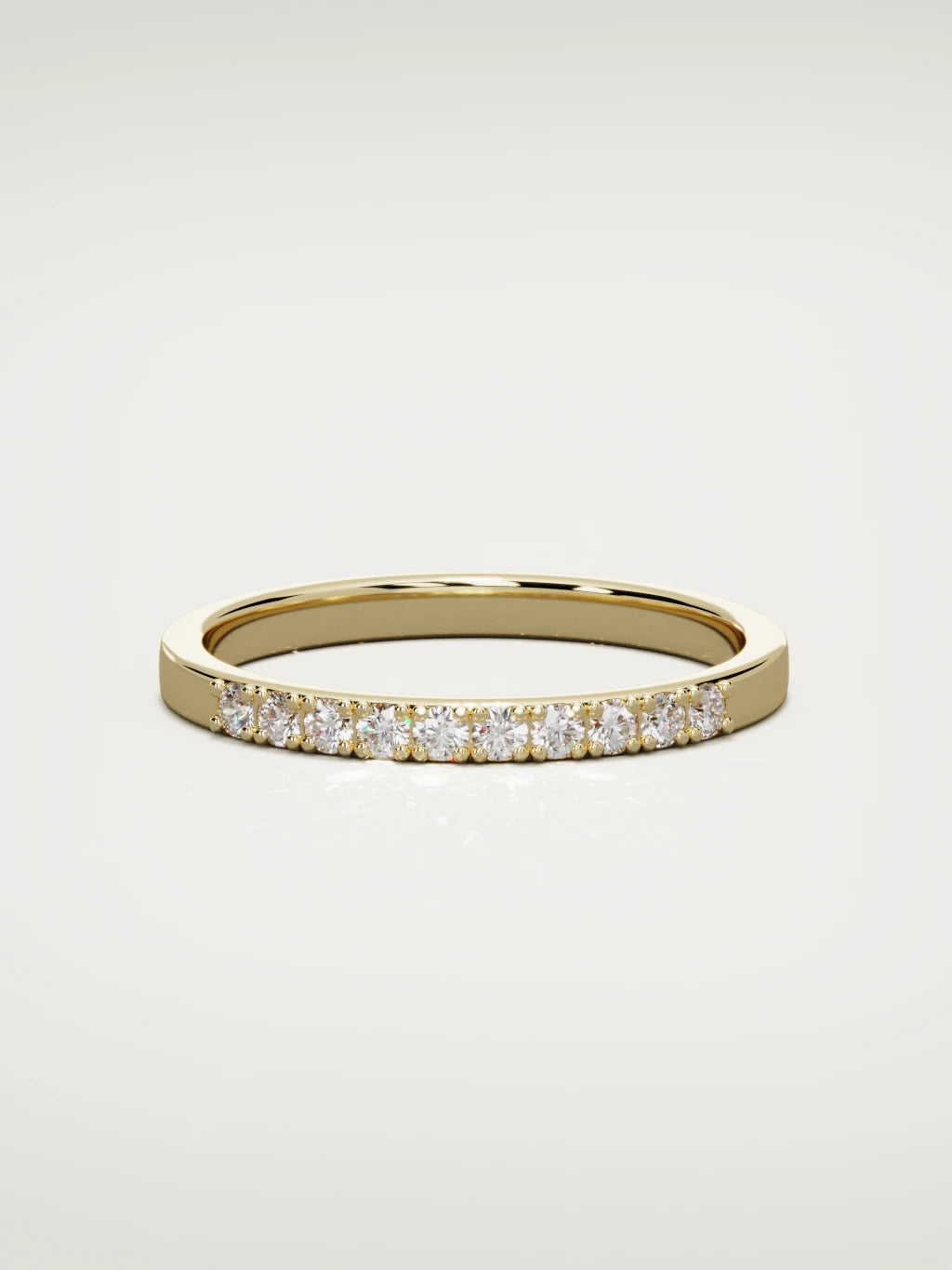The Brisa petite half eternity band in 14K yellow gold, front view