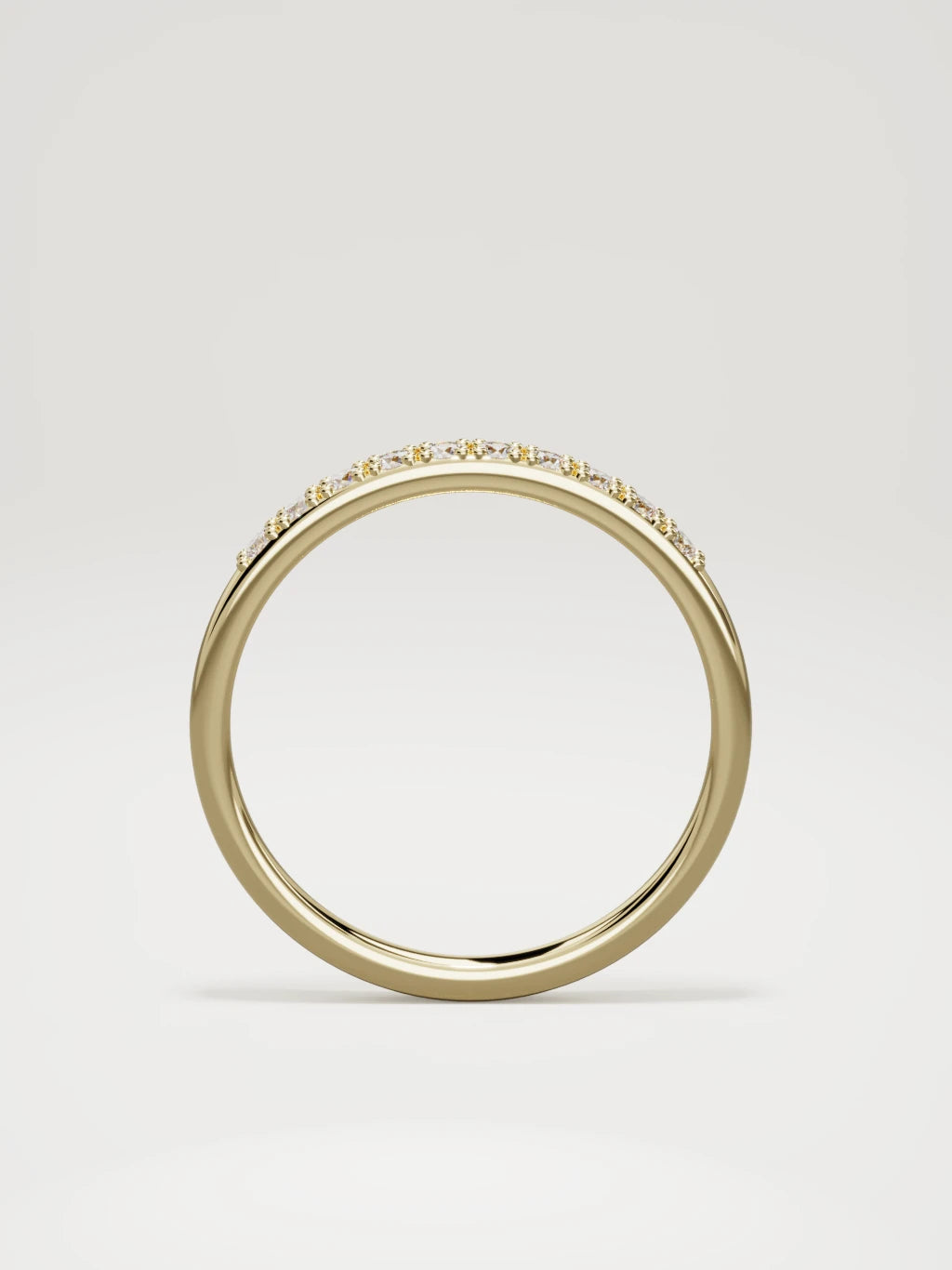 The Brisa petite half eternity band in 14K yellow gold, standing front view