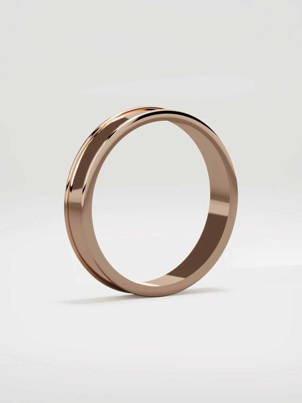 The Valle channel men's wedding band in 14K rose gold, 4 mm, standing three-quarter view