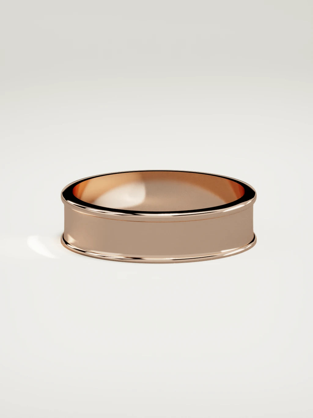 The Valle channel men's wedding band in 14K rose gold, 6 mm, side view