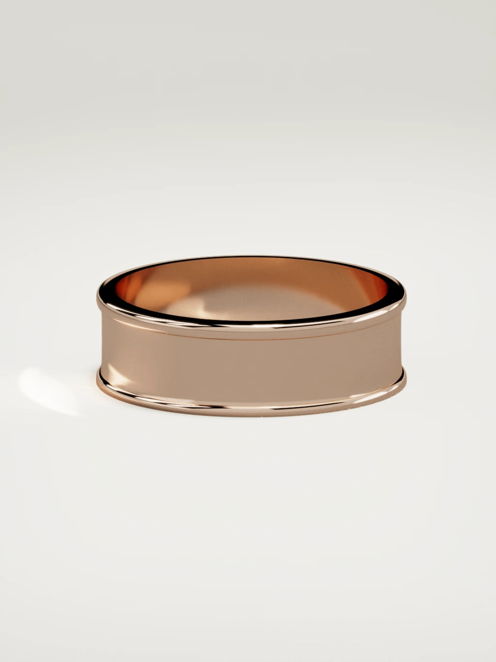 The Valle channel men's wedding band in 14K rose gold, 7 mm, side view