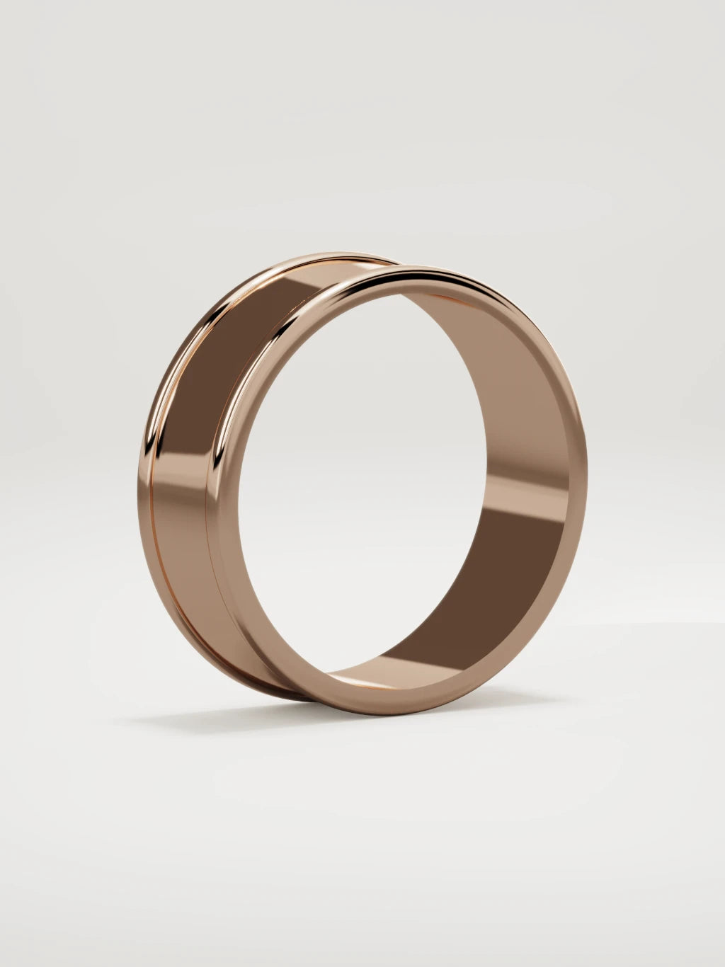 The Valle channel men's wedding band in 14K rose gold, 7 mm, standing three-quarter view