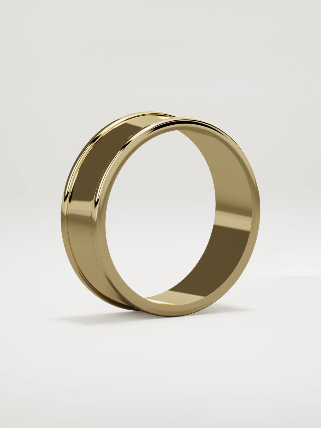 The Valle channel men's wedding band in 14K yellow gold, 7 mm, standing three-quarter view