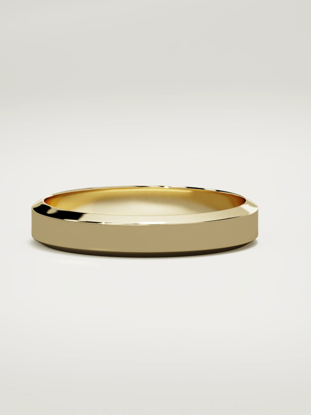 The Canto chamfered-edge men's wedding band in 14K yellow gold, 4 mm, three-quarter view